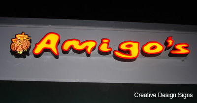 Amigo's - Channel letter sign with logo box. Internally lit with LEDs.