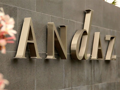 Andaz Hyatt Resort - Polished stainless steel, reverse-halo-lit letters mounted on granite-faced wall