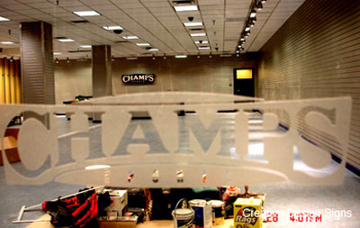 Champs - Etchmark vinyl applied to storefront windows.
