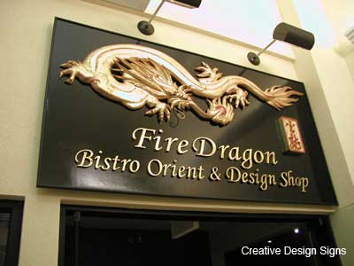 Fire Dragon - Carved HDU with antique gold leaf on black laquered background.