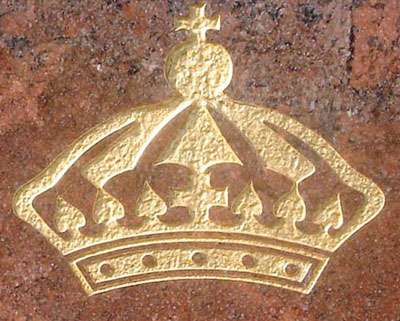 Detail image of the Queens Marketplace Monument sign - Monument sign with engraved gold leaf graphics. Stone base.