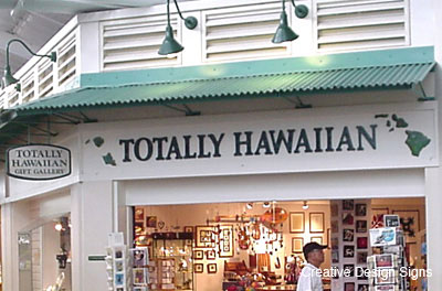 Totally Hawaiian - HDU letters and Hawaiian Islands. Stud mounted on interior storefront.